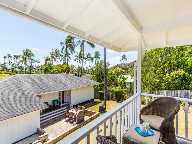 Kailua Vacation Rentals, Lanikai Cottage - Guest cottage lanai, with view of the large yard, main house, and even a bit of the ocean! Cottage now has split air conditioning!