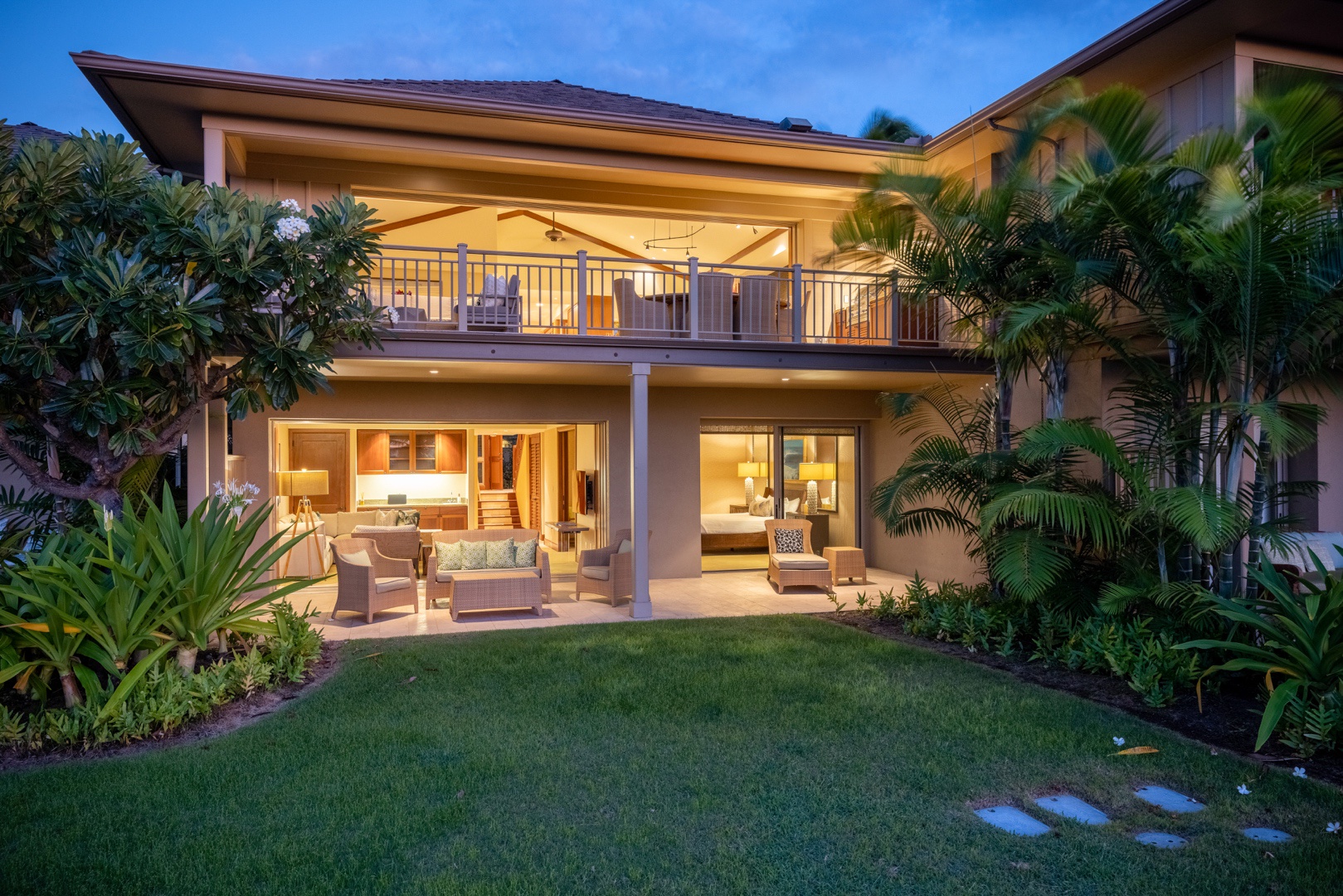 Kailua Kona Vacation Rentals, 3BD Ke Alaula (210B) Villa at Hualalai Resort - Back of this spacious home at twilight, showcasing upper and lower decks and grassy lawn.