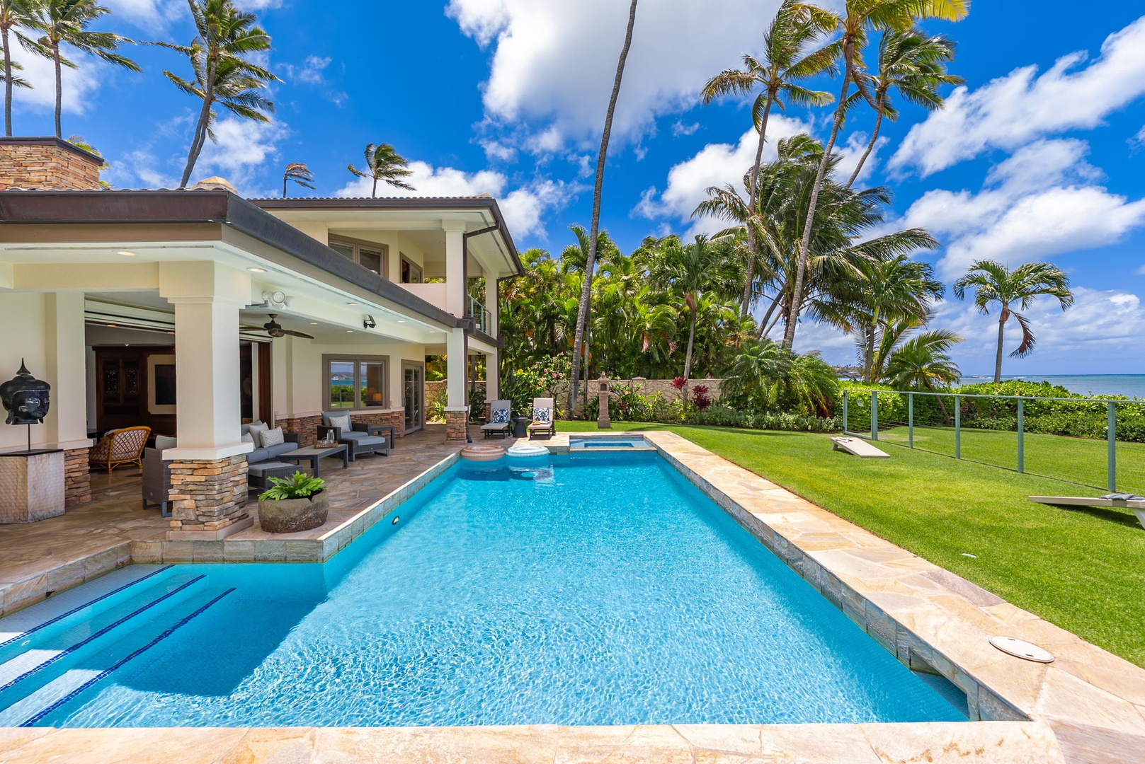 Honolulu Vacation Rentals, Maunalua Estate - Sunlit poolside afternoons and sweeping coastal views capture the ease of beachfront living.