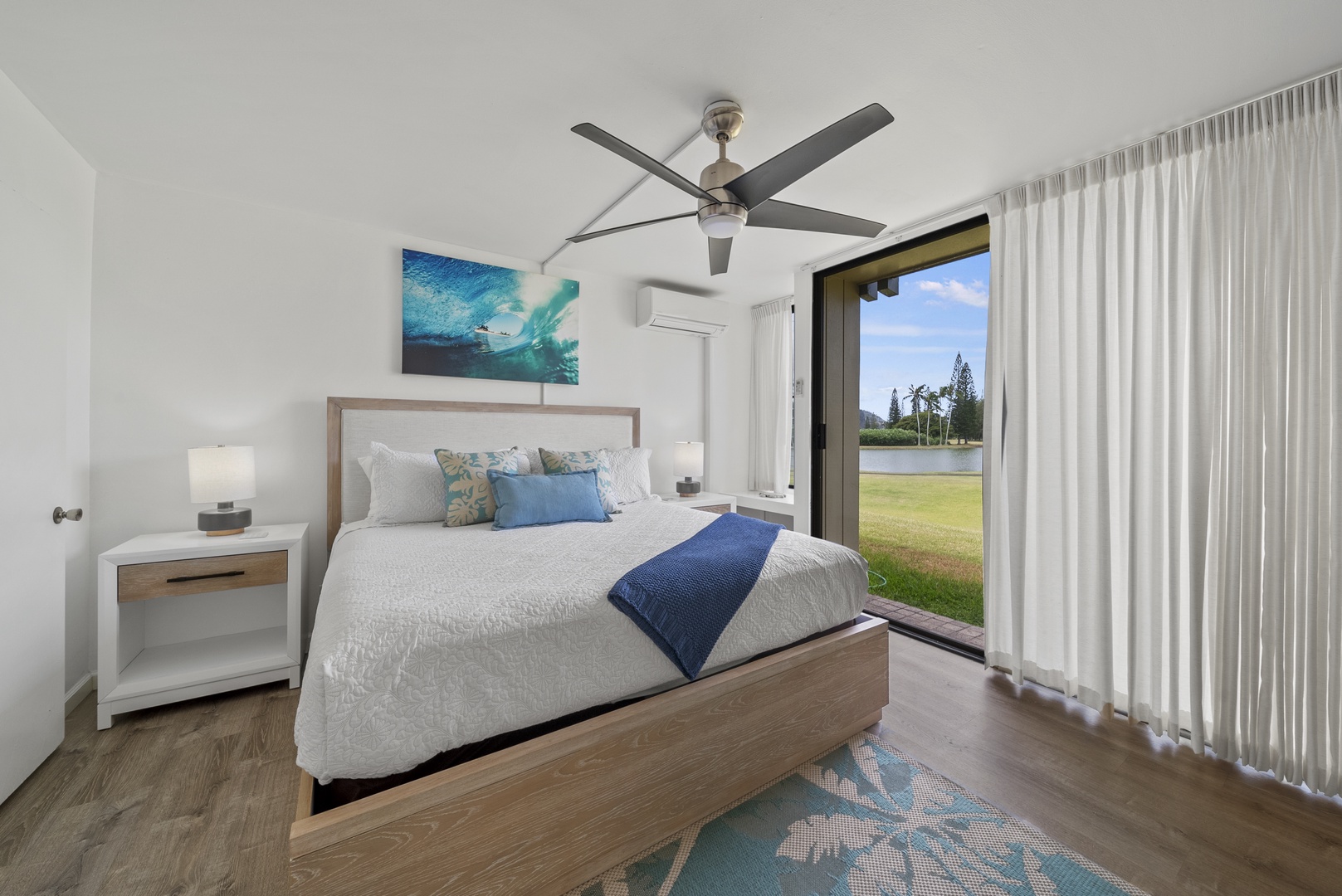 Kahuku Vacation Rentals, Kuilima Estates West #85 - Main downstairs bedroom with a king bed and reading nook to enjoy the views.