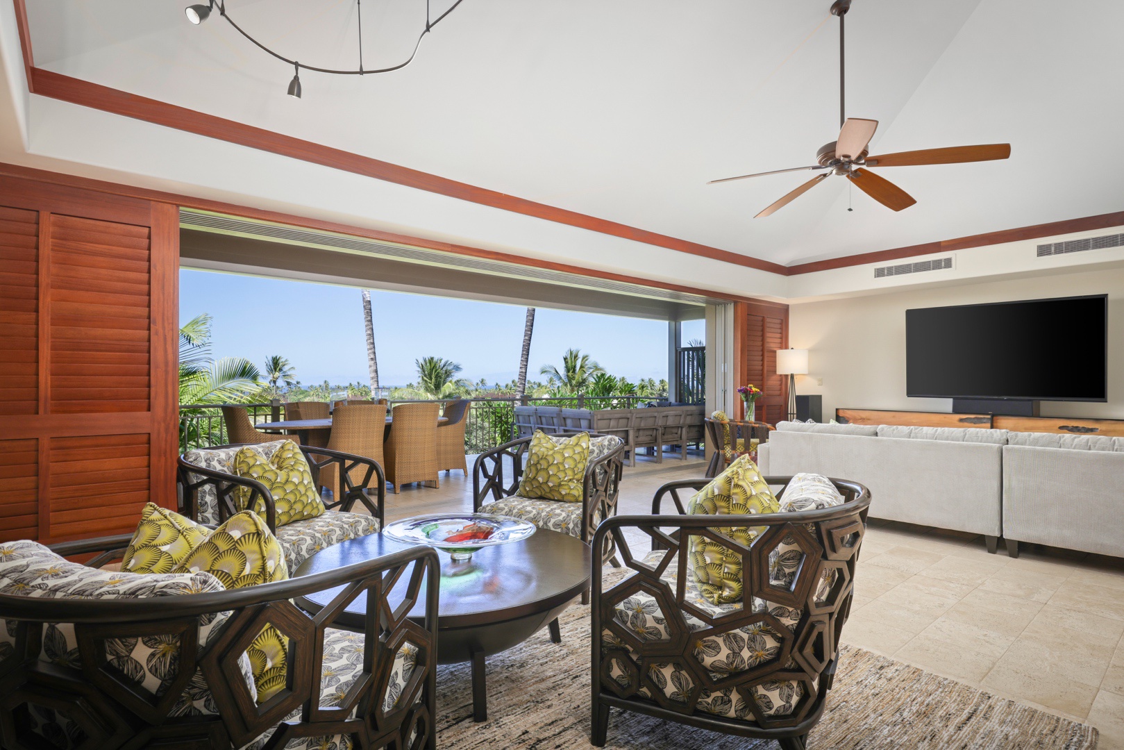 Kailua Kona Vacation Rentals, 3BD Ke Alaula Villa (210B) at Four Seasons Resort at Hualalai - Elegant interior club chair seating & dining area with view to upper deck.