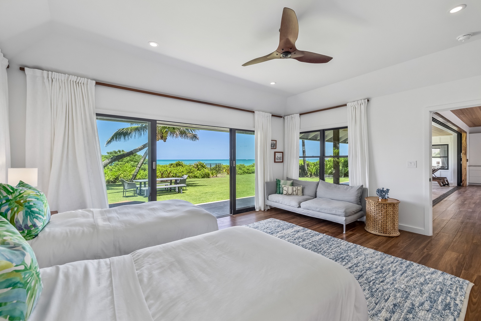 Kailua Vacation Rentals, Kailua Beach Villa - Relax and feel the breeze at Makai North suite with easy outdoor access through sliding doors.