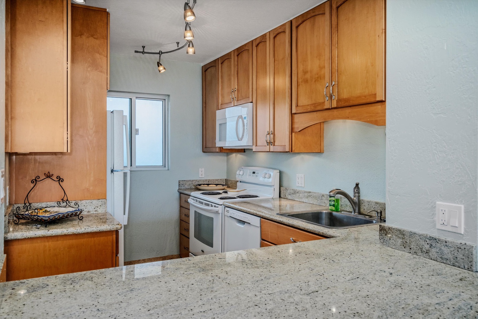 Kihei Vacation Rentals, Menehune Shores 420 - Granite counters and a full appliances for the nights you'd rather cook in than out.