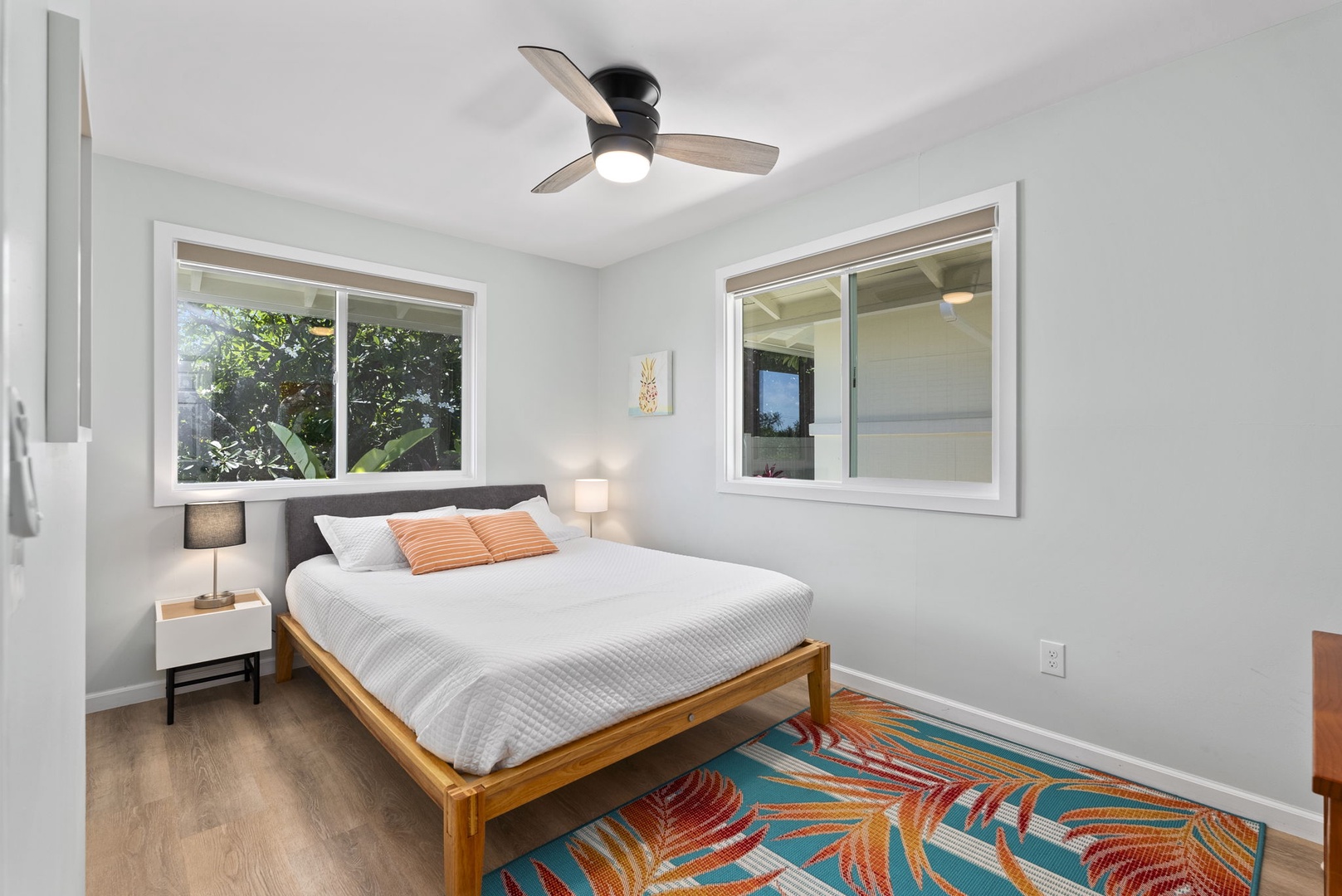 Kailua Vacation Rentals, Hale Alapi'i Lanikai Getaway - This vibrant guest bedroom is a cheerful retreat, featuring a bold, tropical-themed floor.