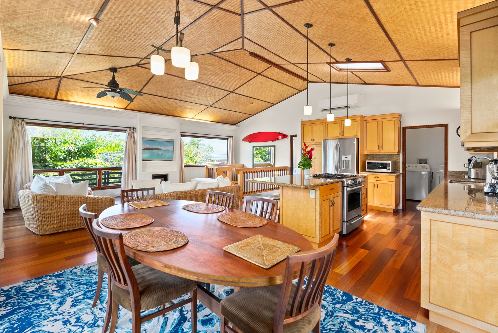 Haleiwa Vacation Rentals, Kealoha Tropical Beach Villa - Enjoy the spacious, open-concept floorplan, perfect for relaxing and entertaining with comfortable wicker seating and a seamless flow from the kitchen to the living area.