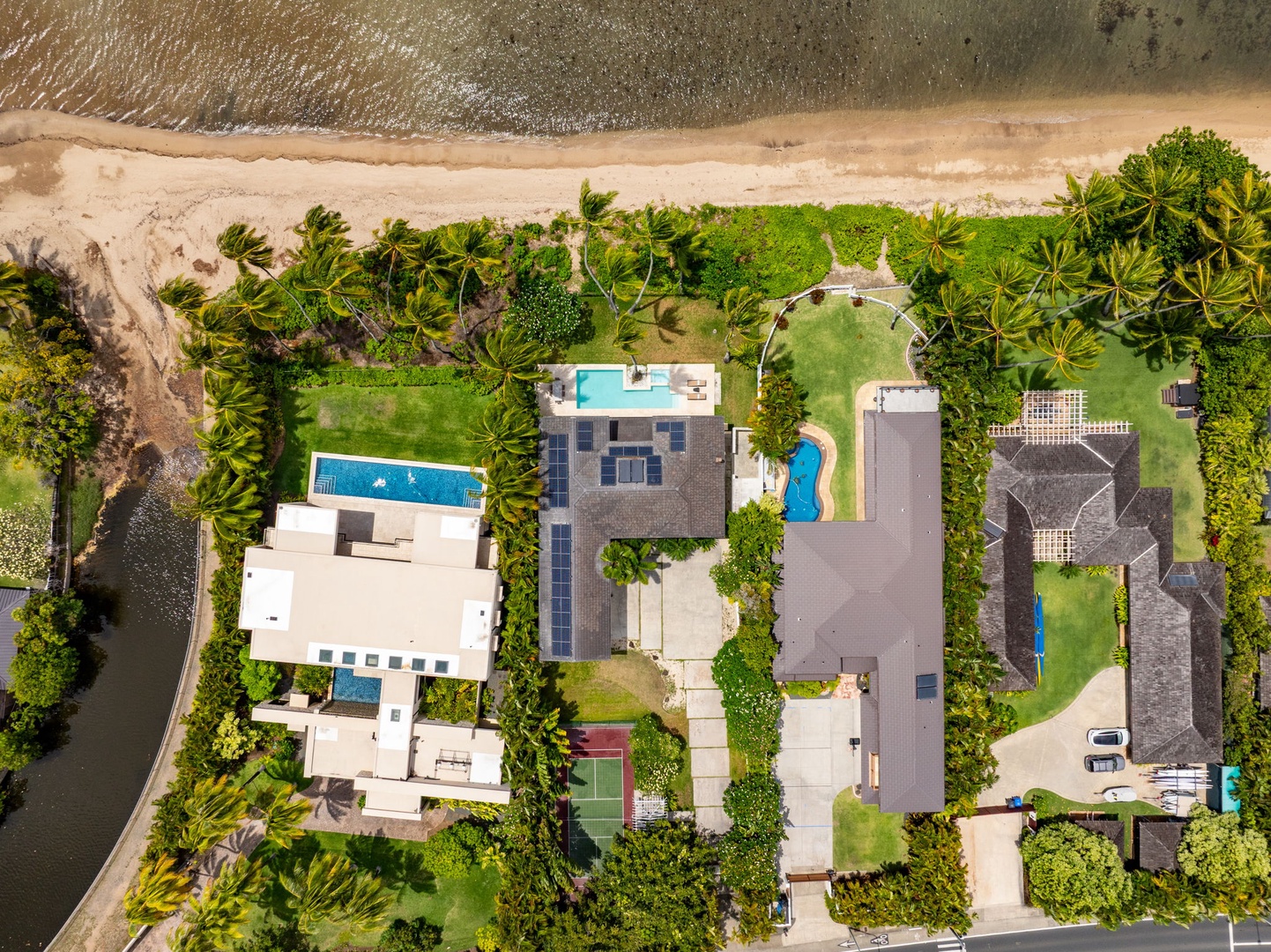 Honolulu Vacation Rentals, Paradise Beach Estate - From above, the full estate reveals its gated grounds, tropical landscaping, private pool, and premier beachfront setting.
