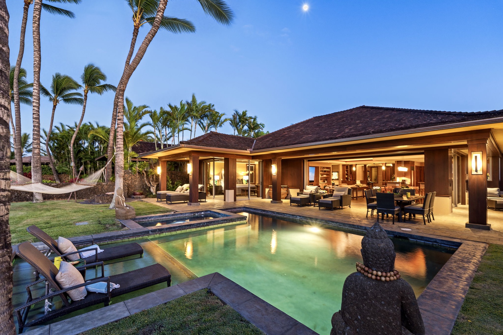 Kailua Kona Vacation Rentals, 3BD Pakui Street Estate (149) at Hualalai Resort - As the sky dims, the house lights up and the pool glows against the last of the color.