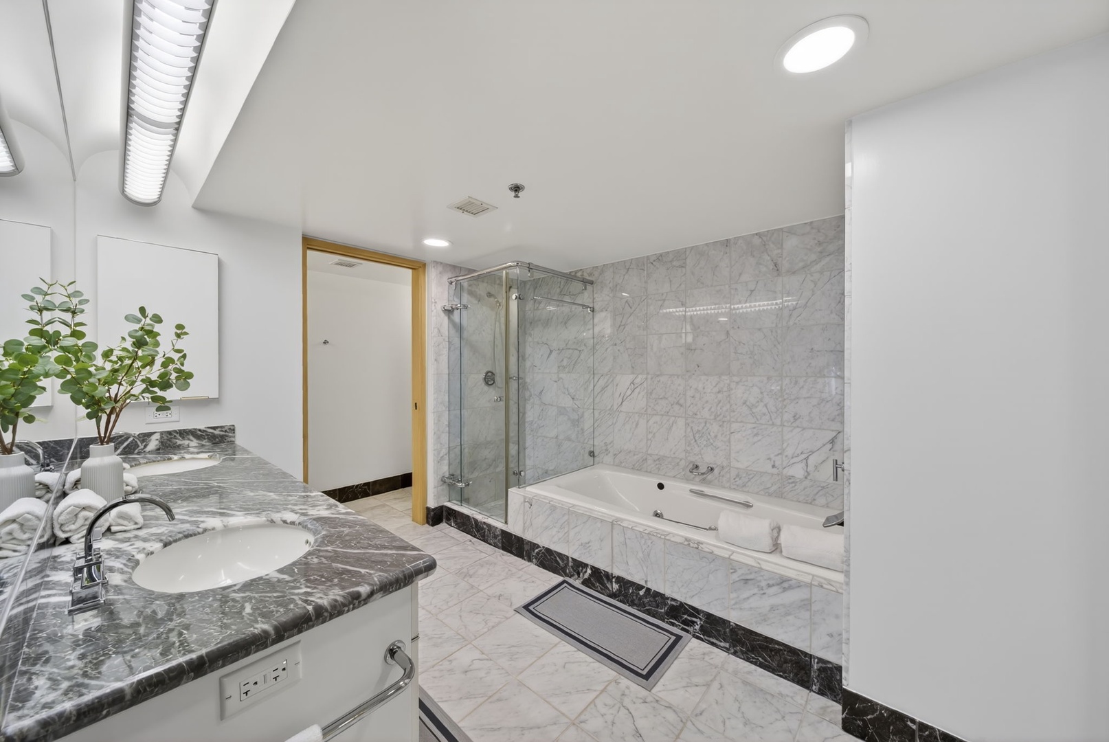 Honolulu Vacation Rentals, Island View at Waikiki Landmark - Refresh in the marble-clad bathroom with a soaking tub and glass walk-in shower.
