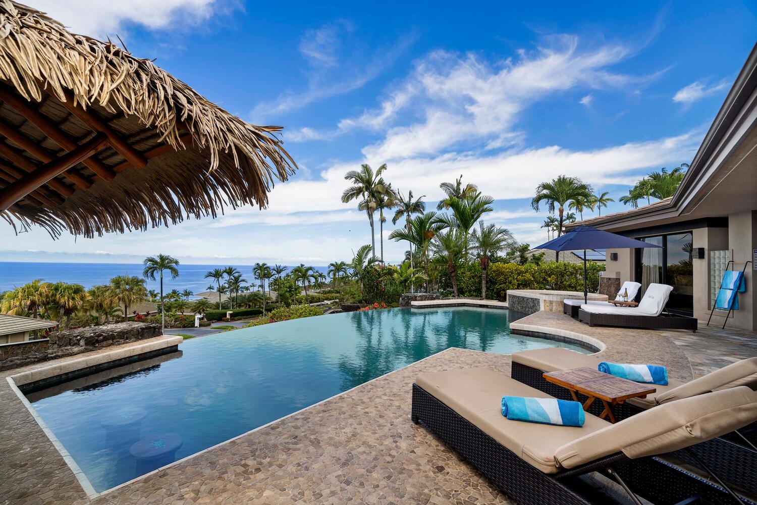 Kailua Kona Vacation Rentals, Island Oasis - Lounge in our poolside chaise lounges, inviting you to relax and savor the island sky.