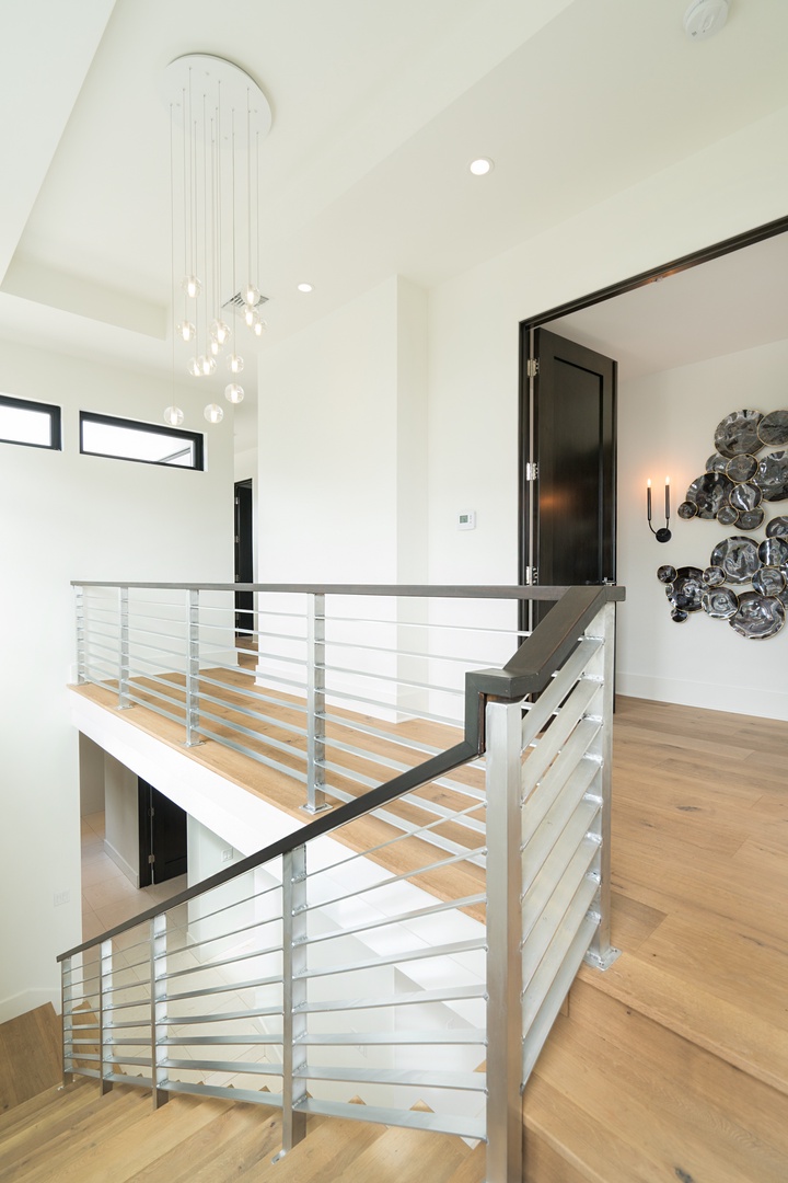 Honolulu Vacation Rentals, Diamond Head Grandeur - Just up the stairs, you’ll find the guest bedrooms, each offering a serene retreat in this luxury Hawaii vacation home.