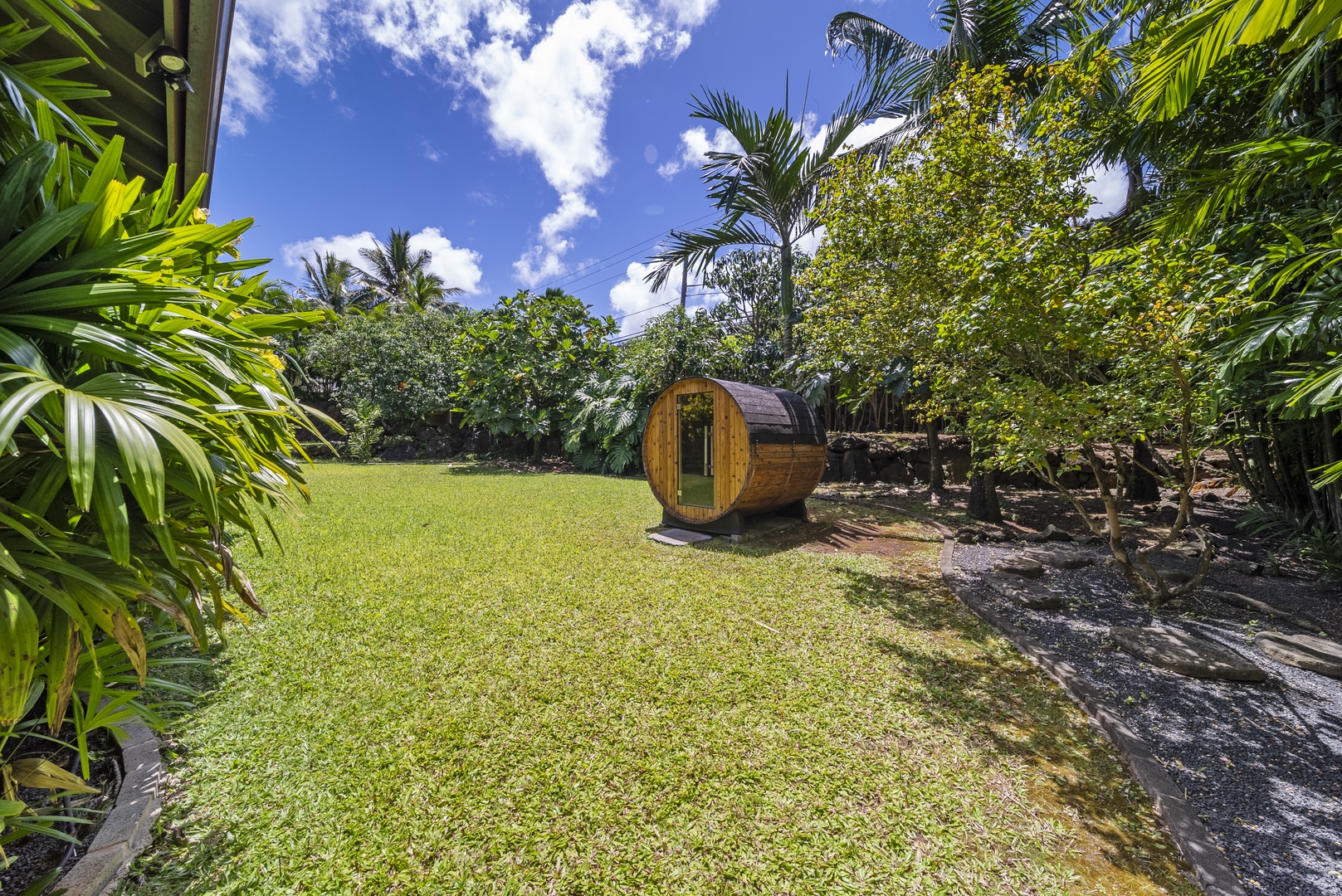 Haleiwa Vacation Rentals, Kaunala Retreat - Finnish-style barrel sauna tucked into a tranquil garden setting—relax and rejuvenate outdoors.
