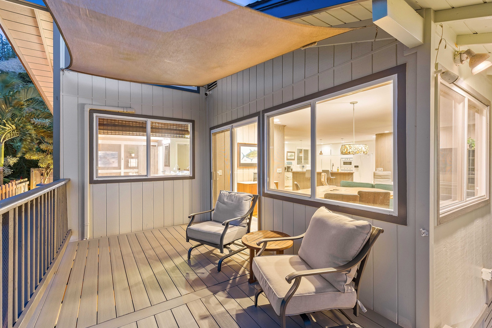 Haleiwa Vacation Rentals, Velzey Villa (3B Vacation Home) - Shaded corner patio lit up at night—an intimate space for winding down the day.
