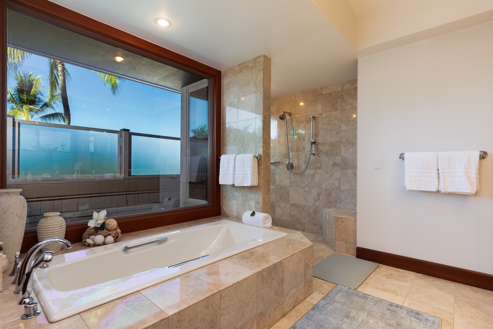 Kailua Kona Vacation Rentals, 3BD Waiulu Villa 111D at Hualalai Resort - Luxurious bathroom with a soaking tub, walk-in shower, and scenic outdoor views.