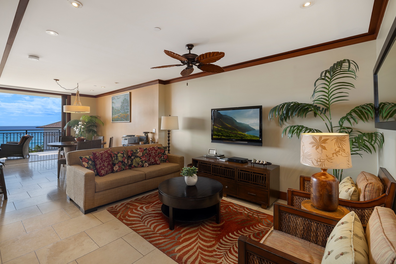 Kapolei Vacation Rentals, Ko Olina Beach Villas O1004 - Spacious living room with TV and vibrant decor, perfect for gathering at the end of the day.