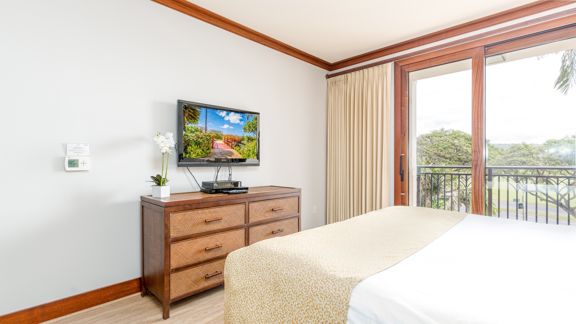 Kapolei Vacation Rentals, Ko Olina Beach Villas O305 - The primary guest bedroom TV and dresser.