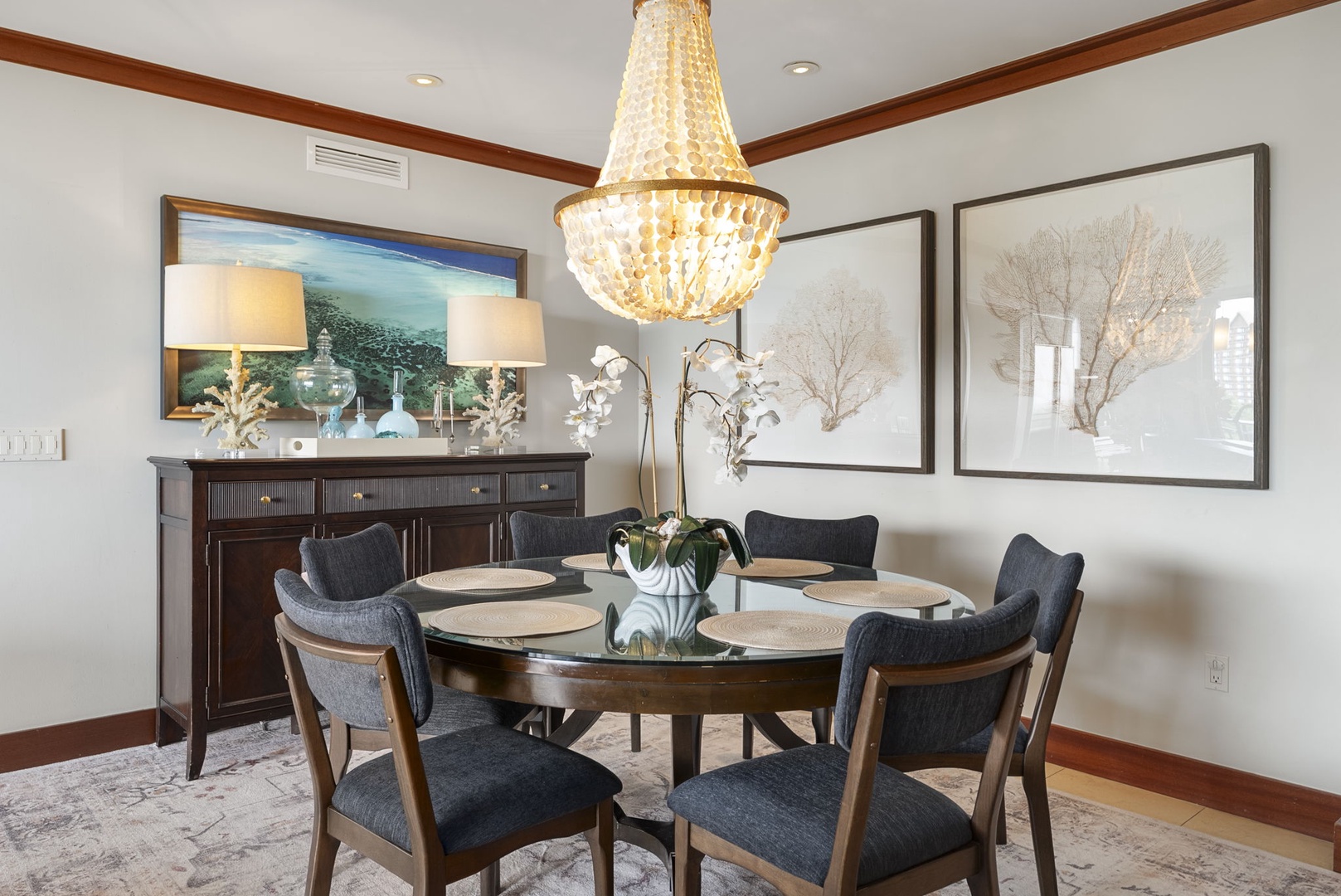 Kapolei Vacation Rentals, Ko Olina Beach Villas B604 - Gather around your elegant dining table beneath a stunning crystal chandelier, where intimate meals become unforgettable moments in this sophisticated space.