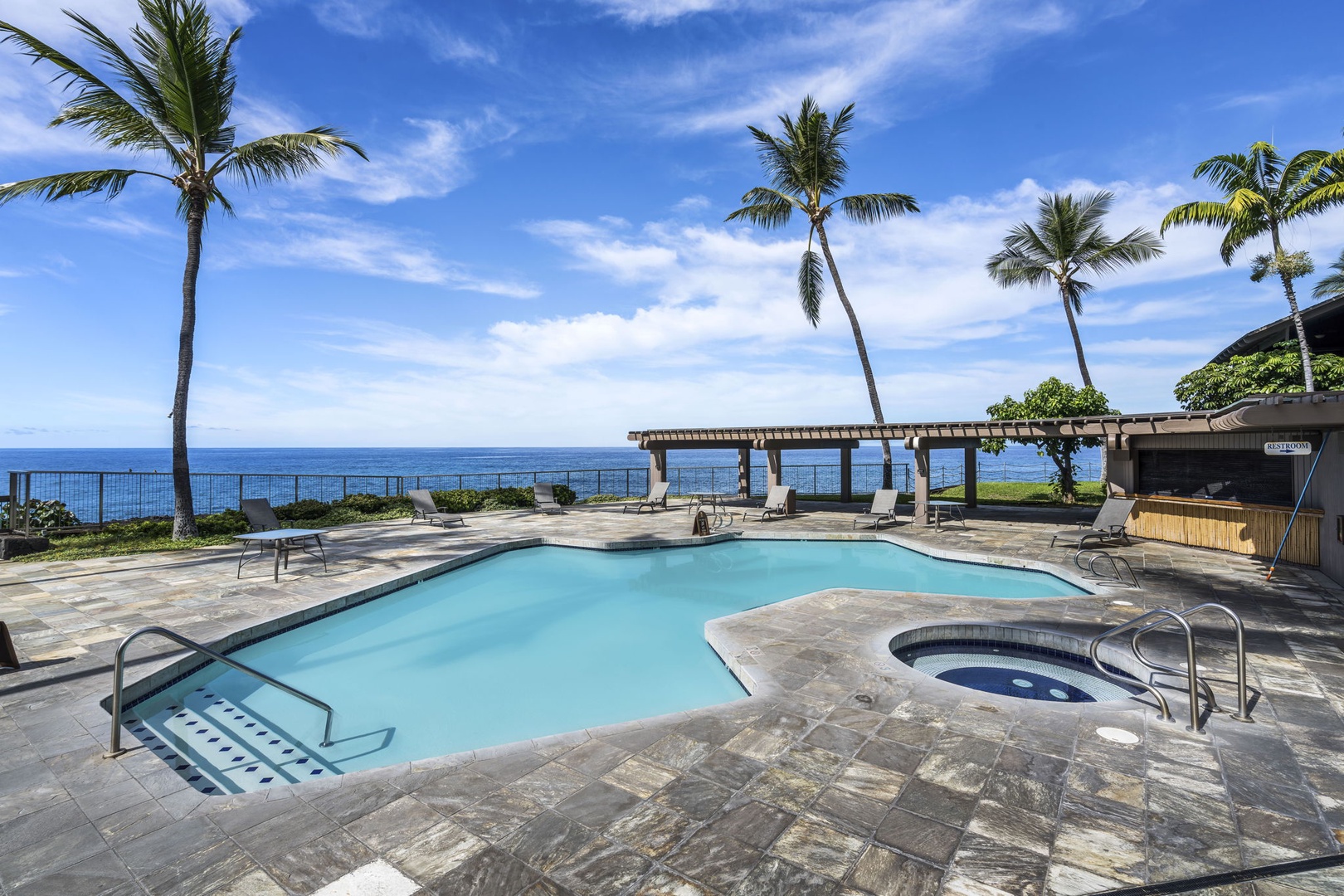 Kailua Kona Vacation Rentals, Kanaloa at Kona 1606 - One of the resort pools sits right at the water's edge, hot tub included.