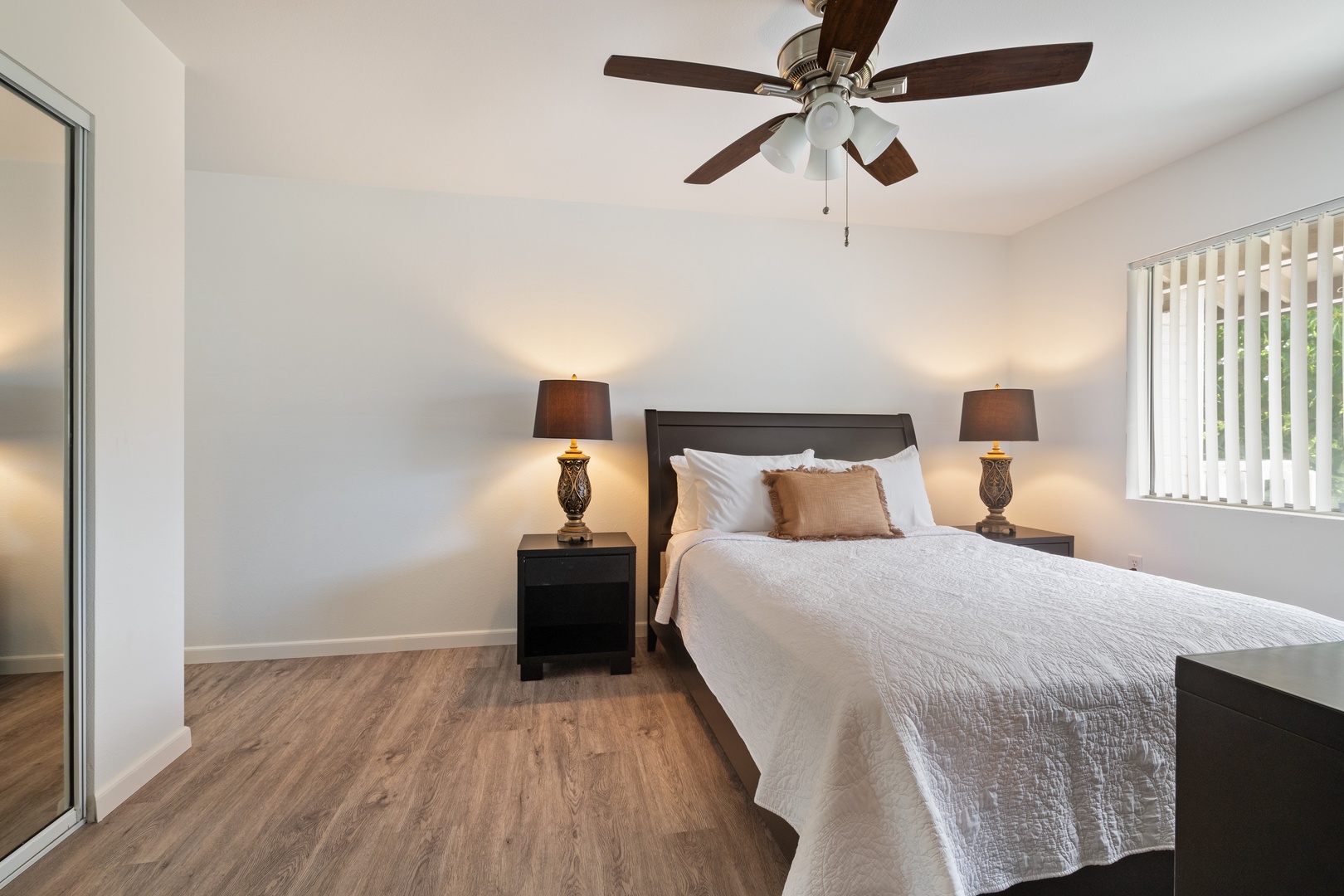 Kapolei Vacation Rentals, Fairways at Ko Olina 7A - Sink into crisp white linens and drift off under your gentle ceiling fan in this serene bedroom sanctuary.