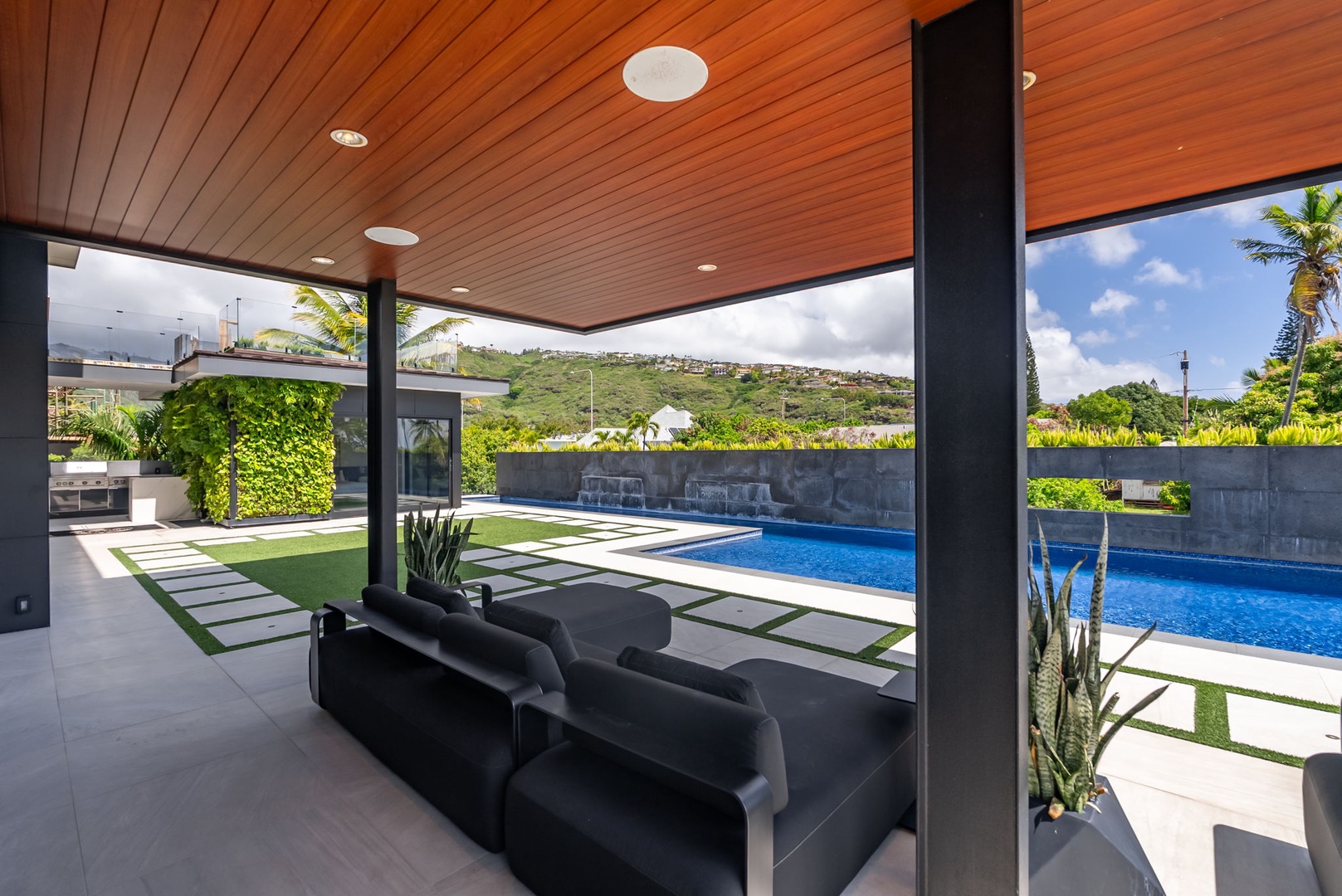 Honolulu Vacation Rentals, Ocean Villa Emilie - Resort-style comfort under the shaded lounge—designed for effortless indoor-outdoor living.