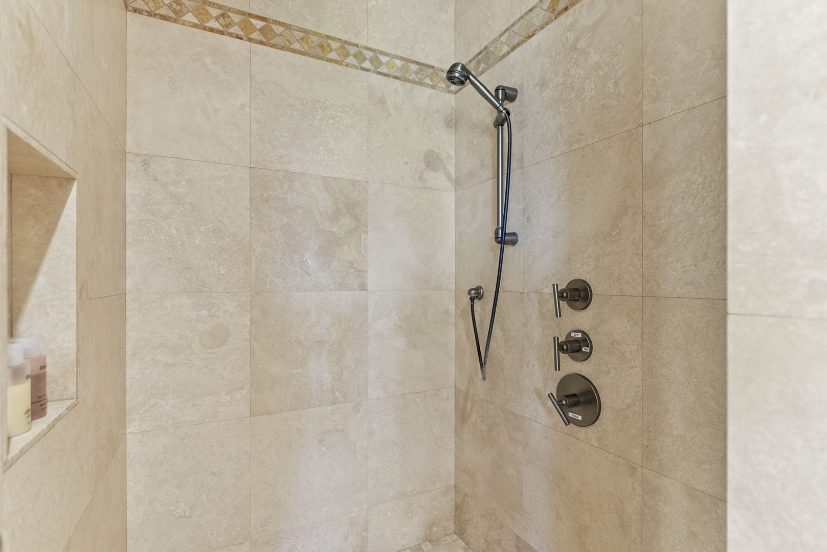 Honolulu Vacation Rentals, Pili Pono - Walk-in shower with rainfall showerhead and modern tiling.