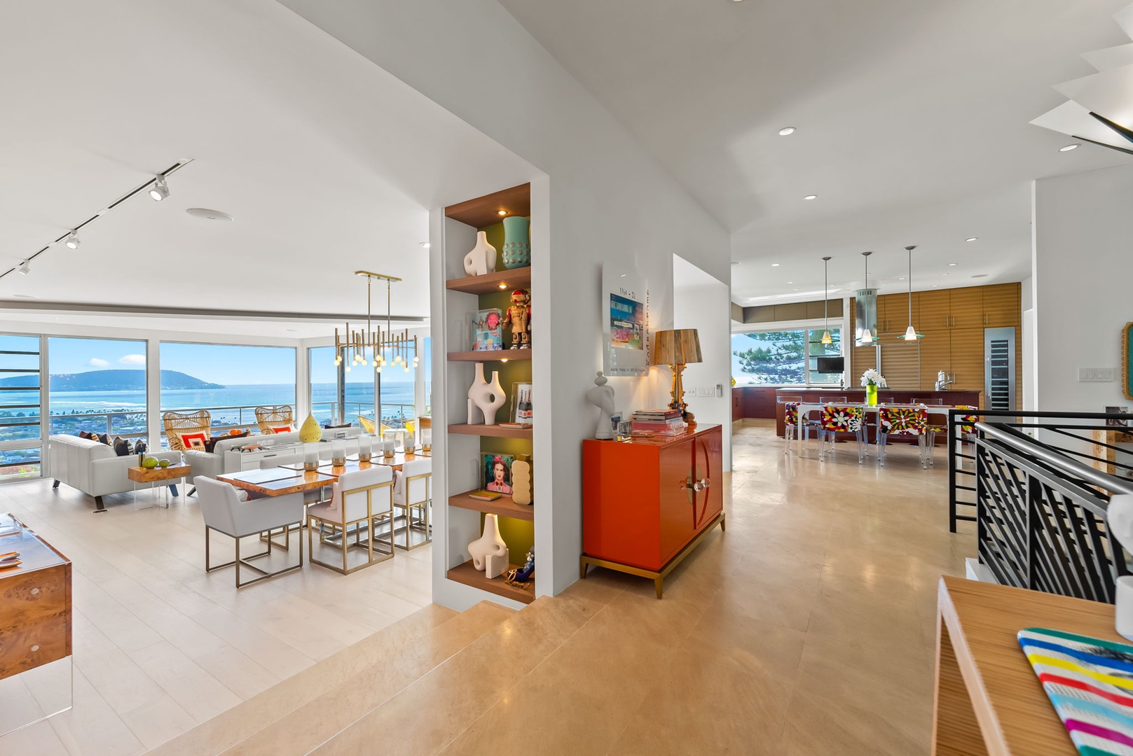 Honolulu Vacation Rentals, Kahala Hills Estate - Bright hallway with curated shelving, modern lighting, and open views into the dining and kitchen areas.