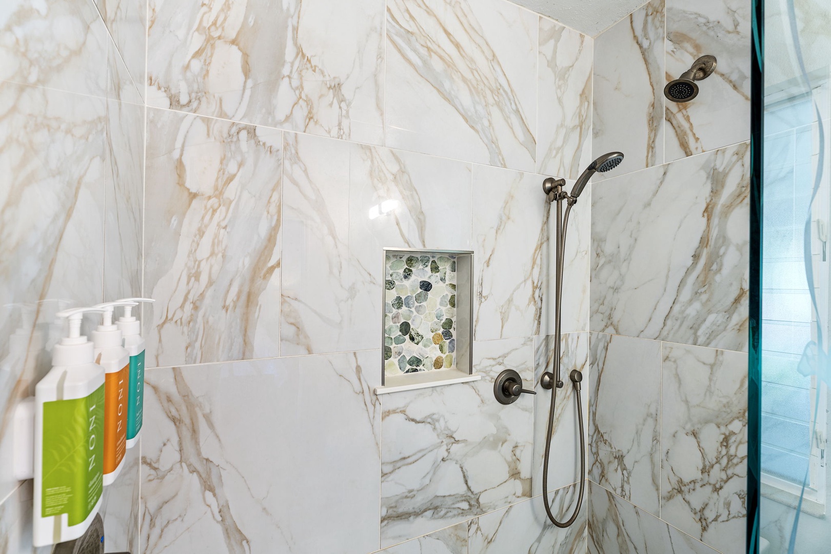 Kailua-Kona Vacation Rentals, Honu Hale - Step into your luxurious marble shower where elegant stone surrounds you and premium amenities await your refreshing retreat.