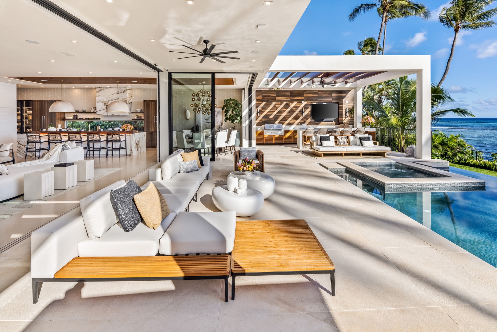 Honolulu Vacation Rentals, Diamond Head Grand Escape - Stretch out on plush loungers beside the pool, designed for sunbathing and poolside relaxation.
