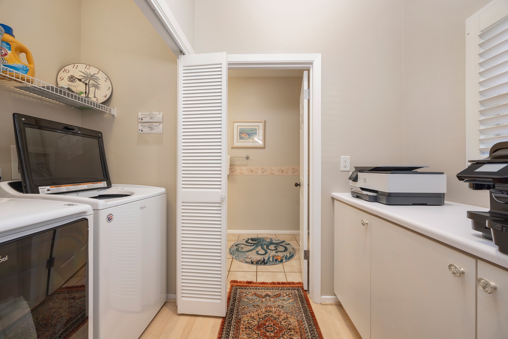 Your dedicated laundry room features a full-size washer, dryer, and convenient office space with printer for your work needs.