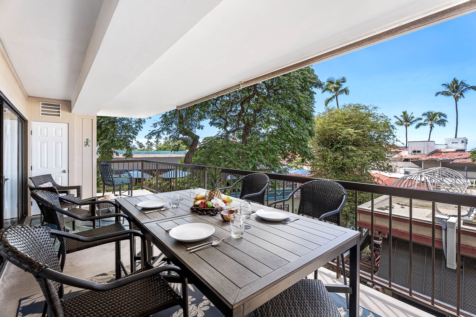 Kailua Kona Vacation Rentals, Kona Plaza 201 - Gather on the expansive wrap-around lanai, designed for relaxation and memorable conversations.