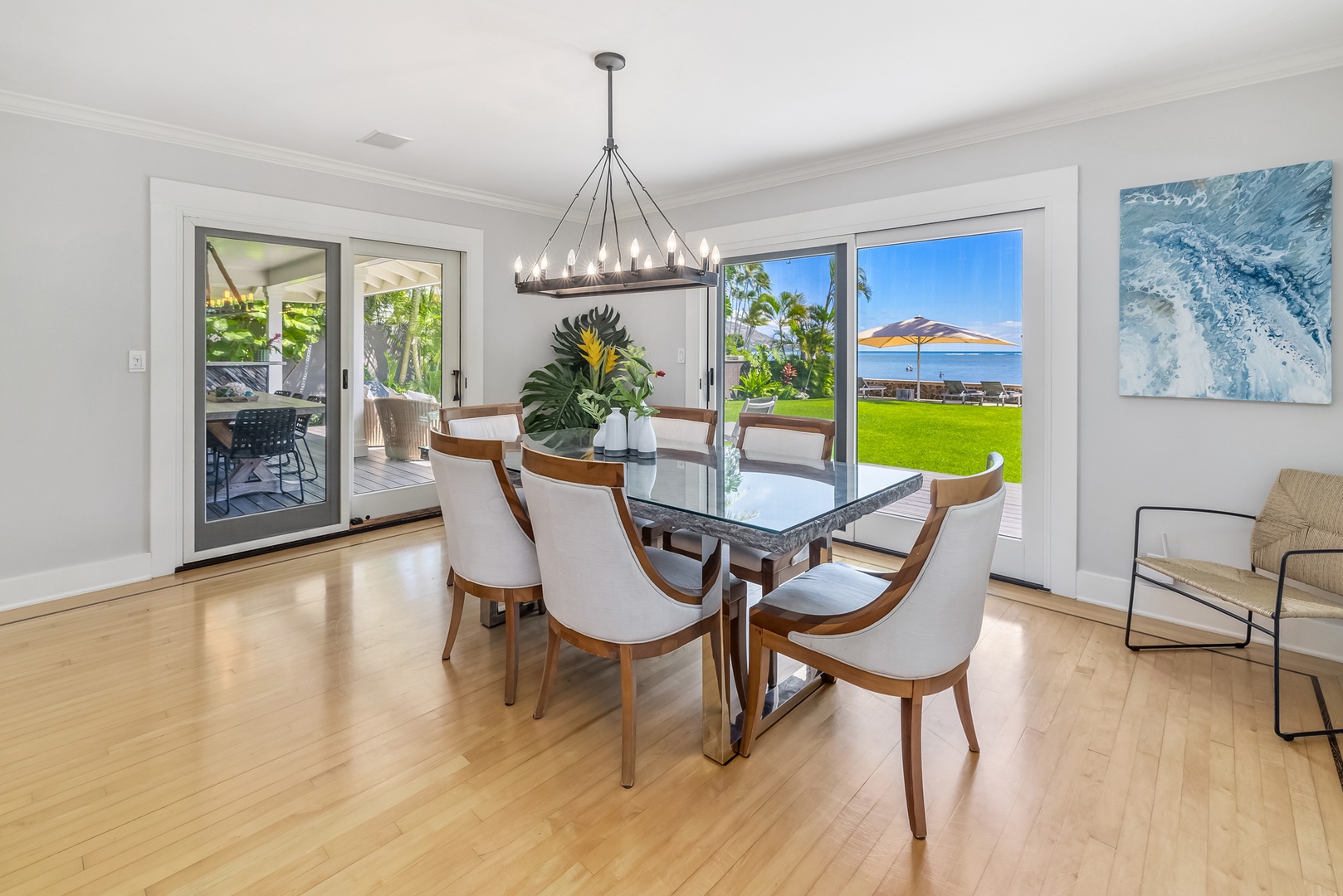 Honolulu Vacation Rentals, Moana Lani - Main House - Every meal at this table comes with the ocean showing through the glass doors.