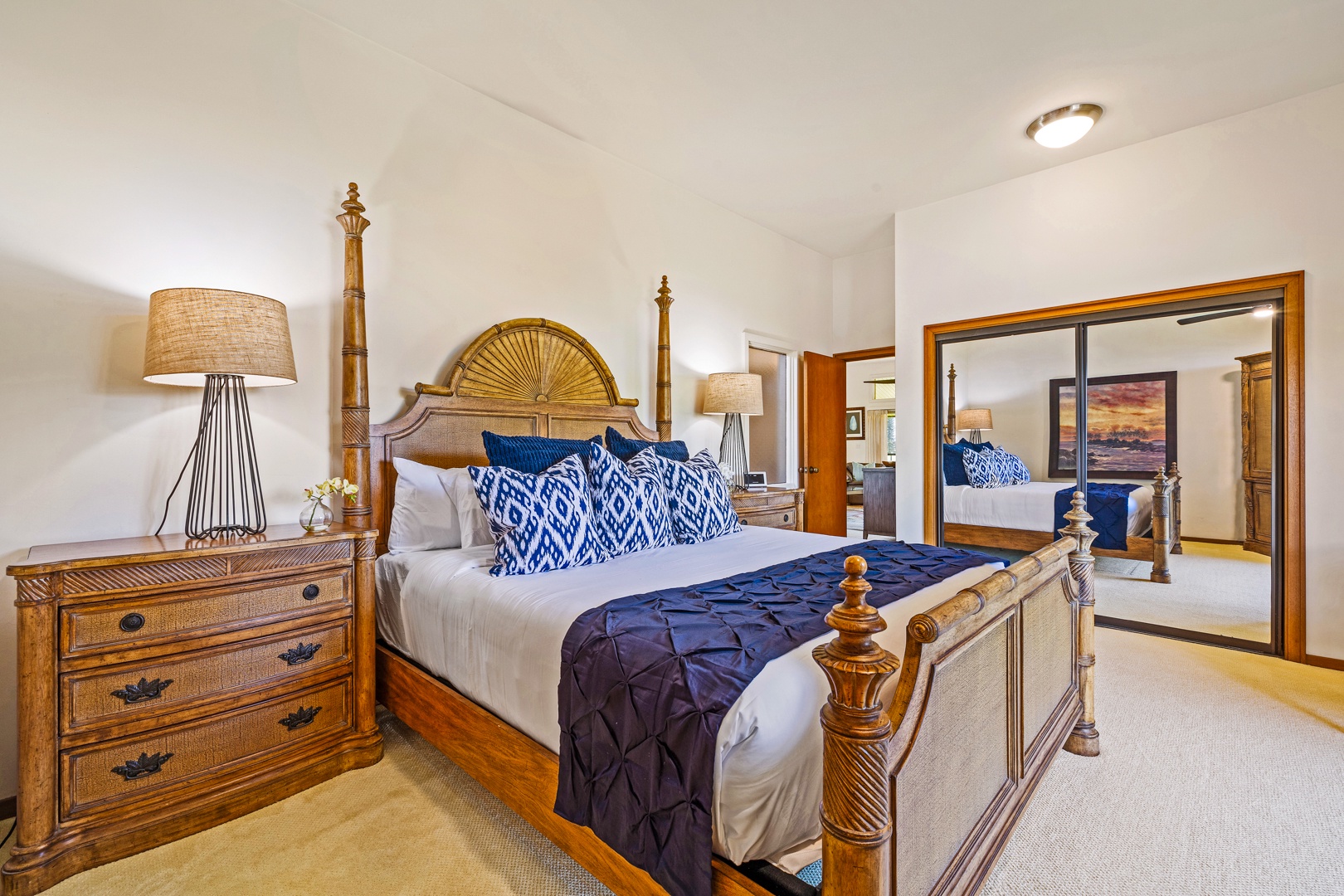 Lahaina Vacation Rentals, Kapalua Ridge 2321 - Relax in the luxurious primary bedroom featuring a spacious bed adorned with soft pillows and beautiful wood accents