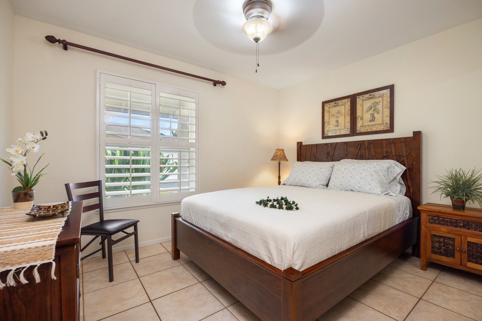 Kapolei Vacation Rentals, Coconut Plantation 1150-2 - Relax in your peaceful bedroom with handcrafted wooden furnishings and crisp linens, where natural light filters through plantation shutters.