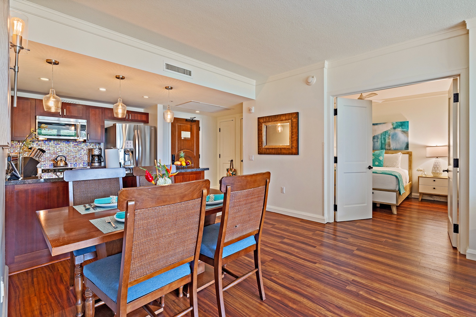 Lahaina Vacation Rentals, Honua Kai Konea 206 - The open dining area is conveniently located next to the kitchen, featuring beautiful hardwood floors and a seamless flow into the living space