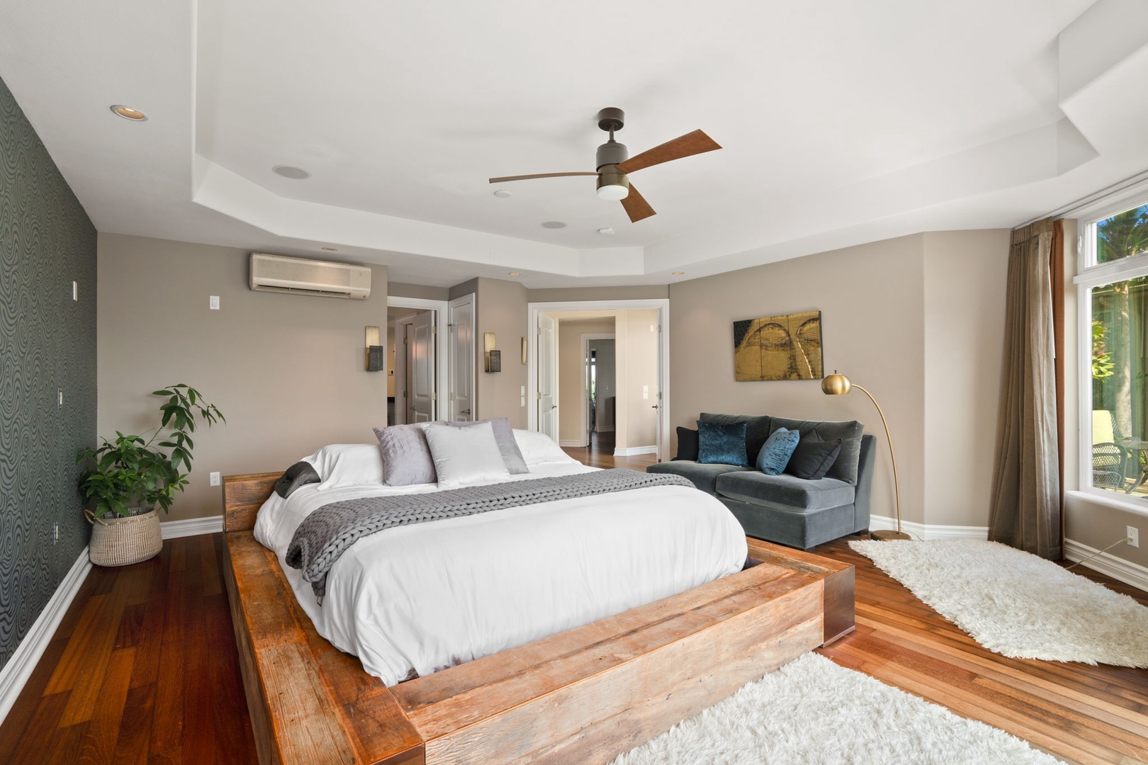 Princeville Vacation Rentals, Kaiulani #8 - Sink into the primary king bed on a wide wood platform.