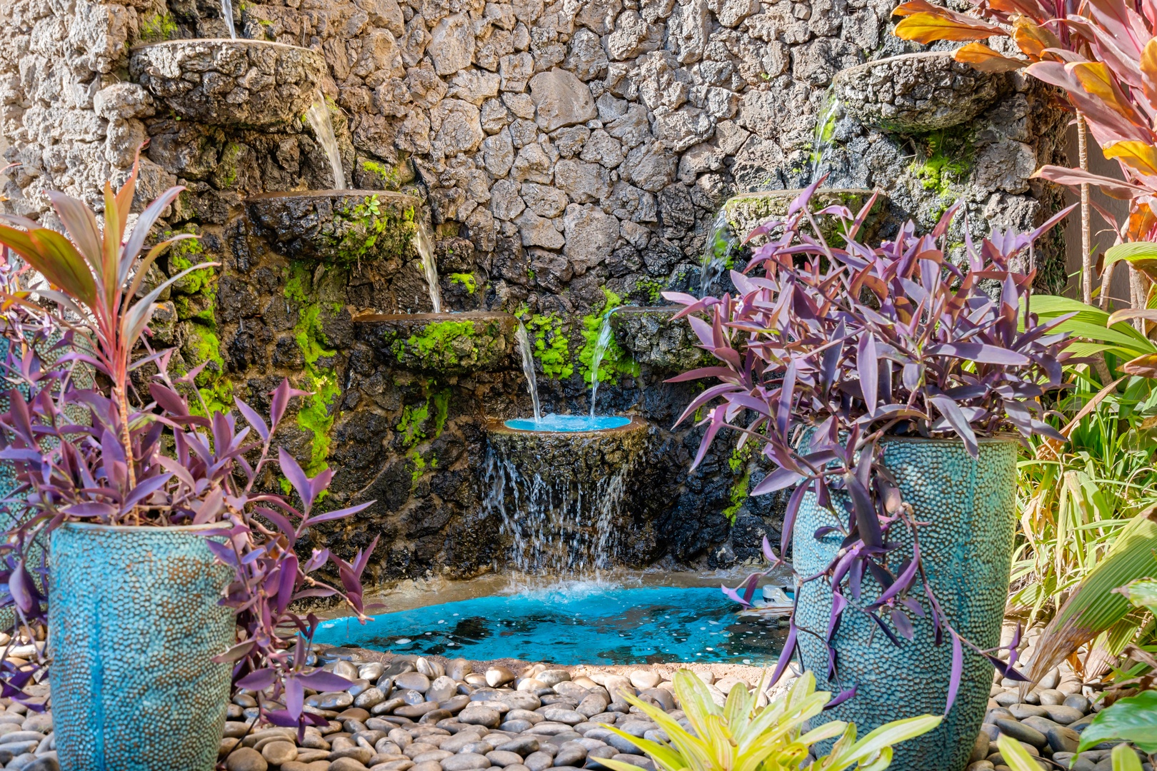 Kihei Vacation Rentals, Menehune Shores 316 - A tiered lava-rock fountain runs quietly through the courtyard, easy to miss and easy to love.