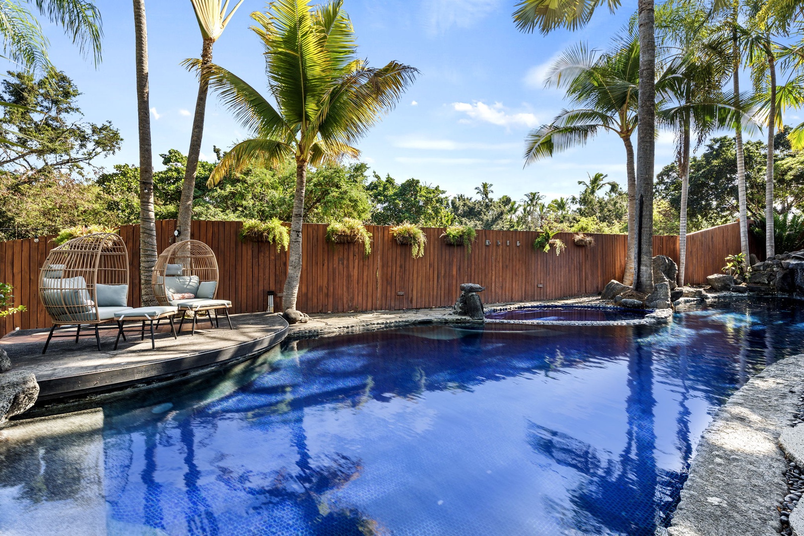 Kailua-Kona Vacation Rentals, Hahalua Bay Villa - Slip into your private tropical oasis where swaying palms frame crystal-blue waters and stylish loungers await your perfect poolside escape.