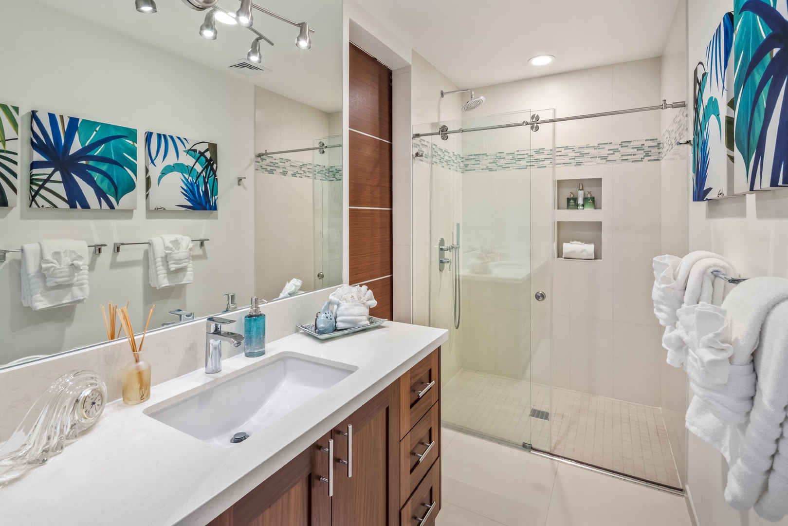 Honolulu Vacation Rentals, Kahala Grand Splendor - The downstairs guest room has an ensuite with a sleek vanity and glass shower.