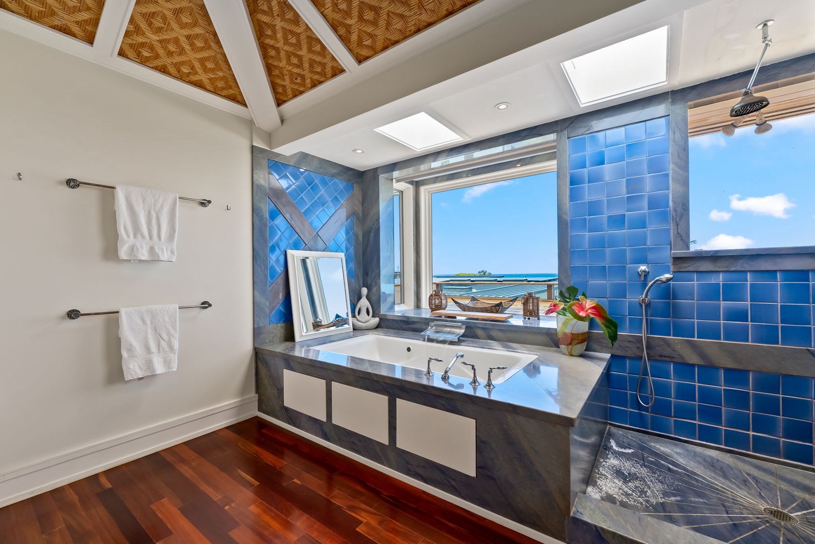 Kailua Vacation Rentals, Leaf House - Soak in ocean vistas from your private soaking tub, framed by vibrant blue tiles and natural light streaming through skylights overhead.