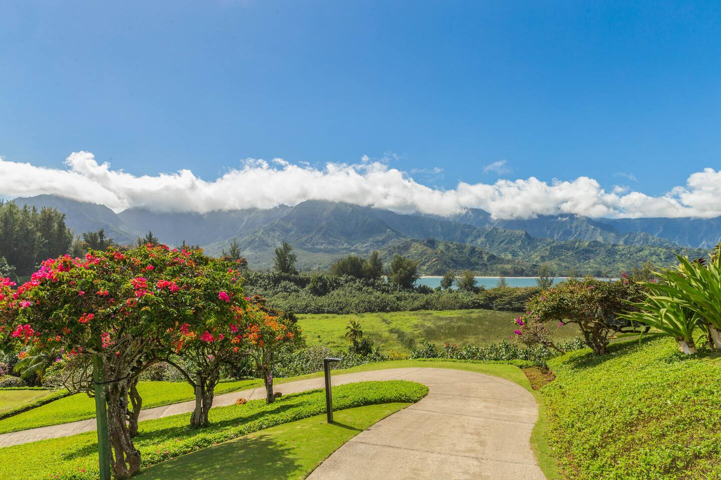 Princeville Vacation Rentals, Hanalei Bay Resort 4302/3 - Stroll along picturesque pathways surrounded by lush greenery and mountain views.