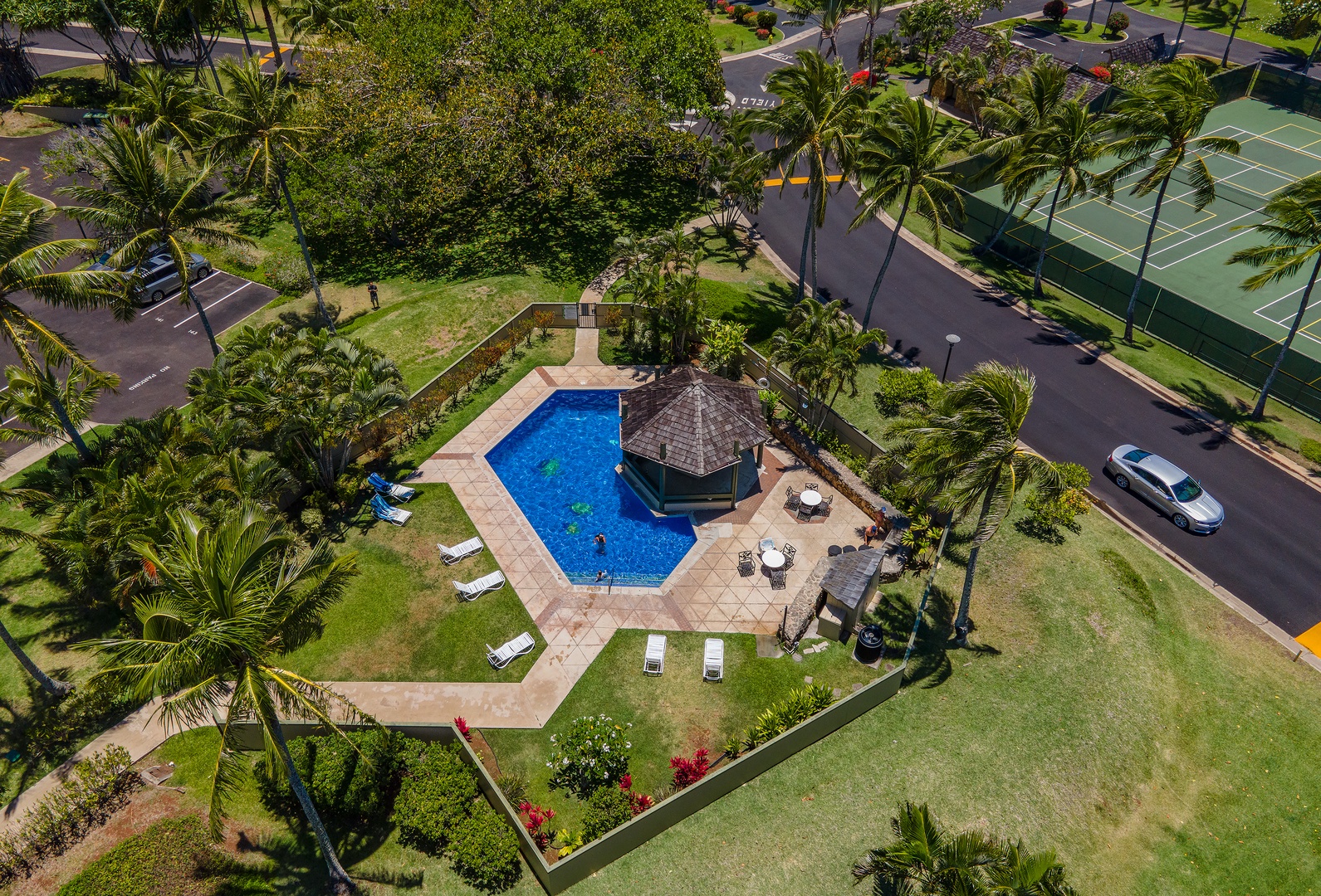 Kahuku Vacation Rentals, Pulelehua Kuilima Estates West #142 - Aerial shot of the community pool area.