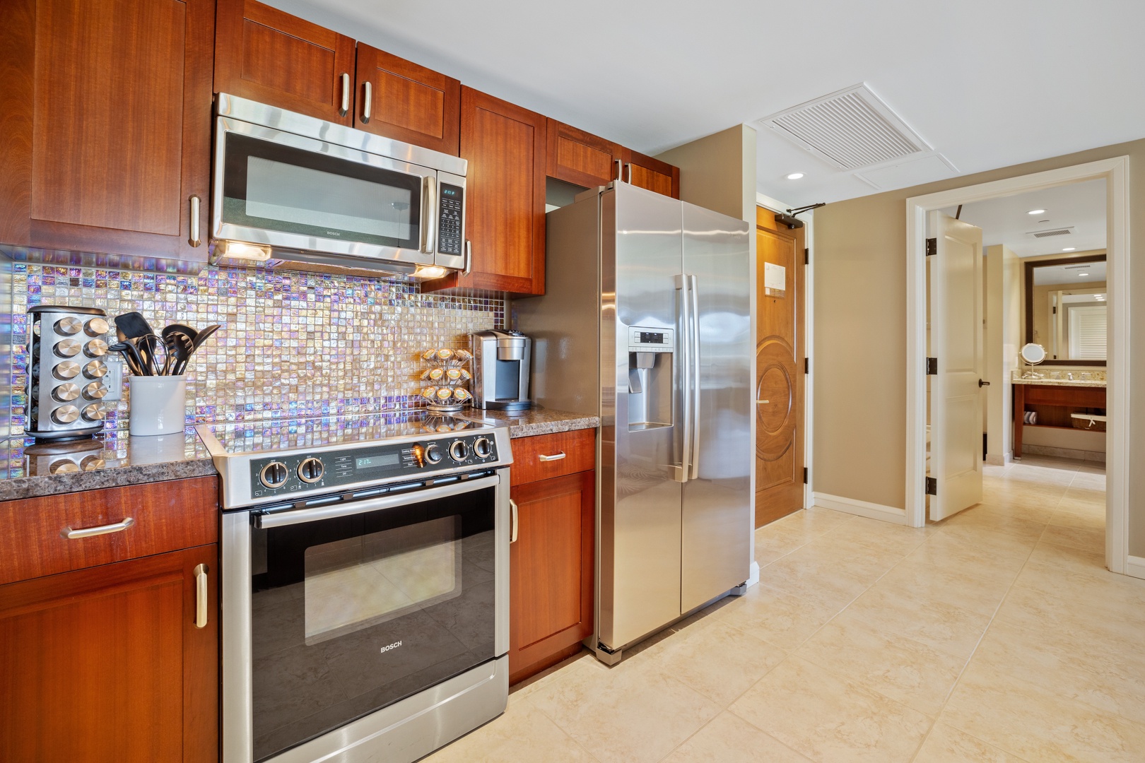 Lahaina Vacation Rentals, Honua Kai Konea 204 - The modern kitchen is equipped with stainless steel appliances, offering a stylish and functional space for preparing meals.