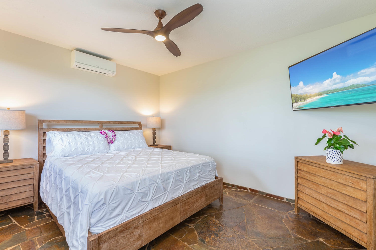 Princeville Vacation Rentals, Pohaku Villa - Downstairs guest bedroom with large flat-screen television