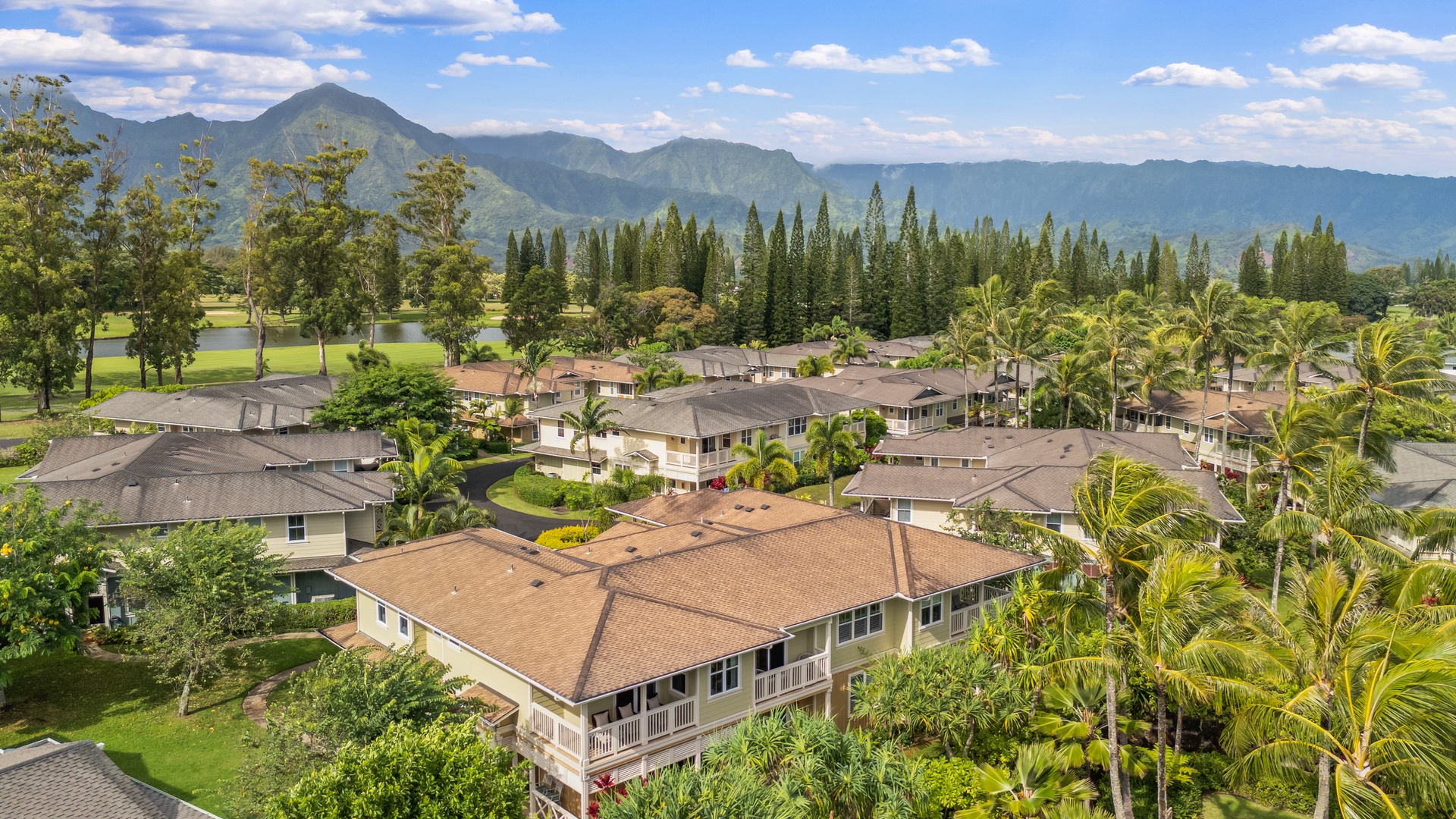 Princeville Vacation Rentals, Kaimana Villa - Tropical residential community nestled between lush mountains and manicured grounds, offering a peaceful Hawaiian setting.