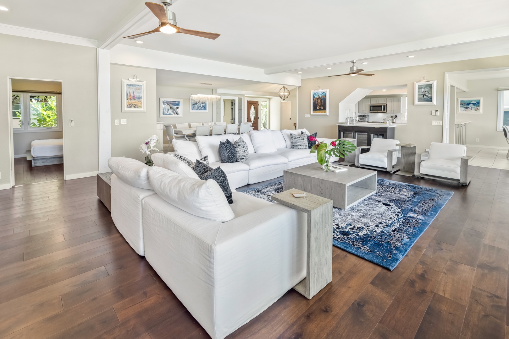 Honolulu Vacation Rentals, Nanea Kai Villa - The living area features plush sectional sofas, TV and split AC.