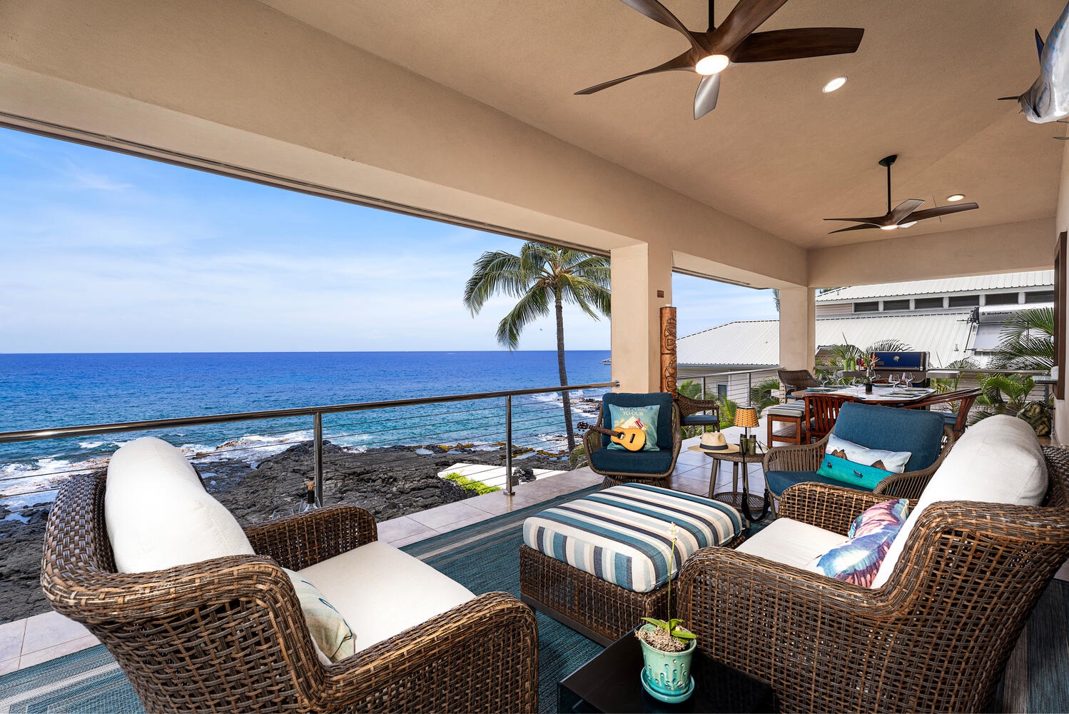 Kailua Kona Vacation Rentals, Kailani Vista - Stretch out with a novel or grab an afternoon nap beneath the ceiling fan; turtles often surface in the waves mere yards beyond the railing.