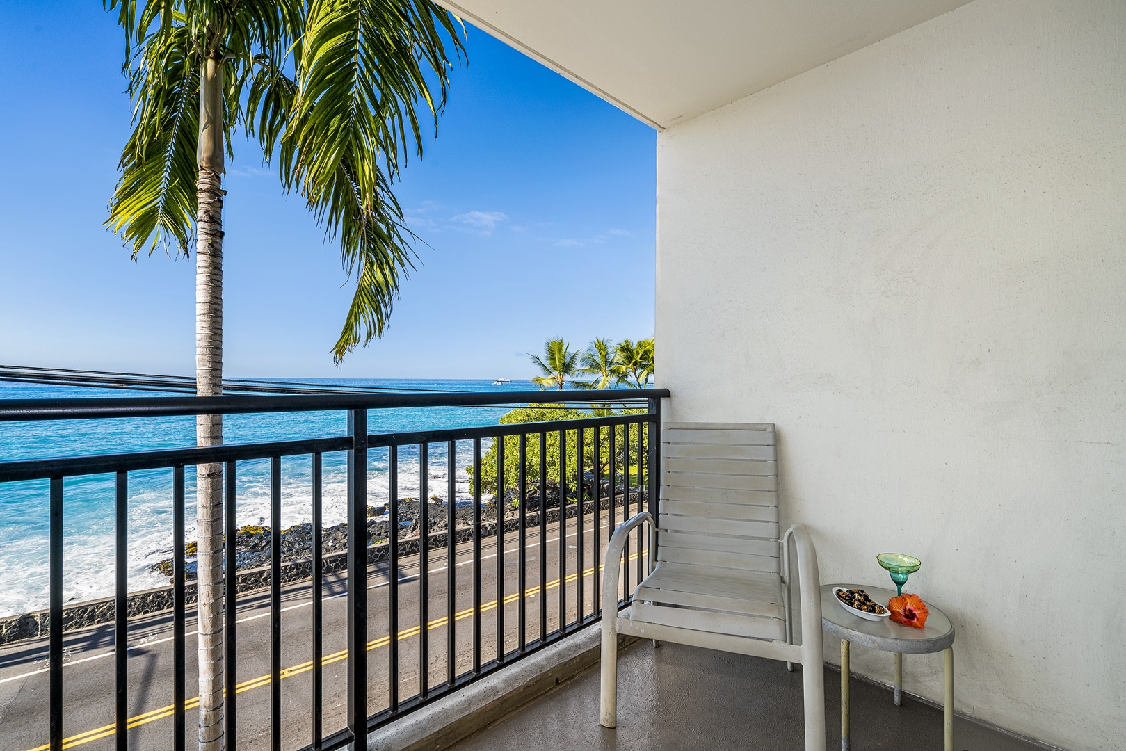 Kailua Kona Vacation Rentals, Kona Alii 201 - Private seating on the lanai to watch the waves roll in!