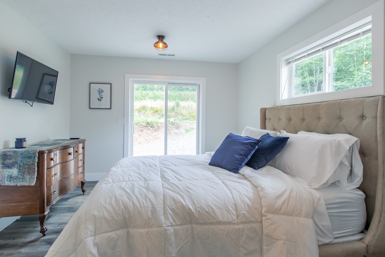 Nehalem Vacation Rentals, Nehalem Coastal Oasis - Guest Bedroom comes with a queen bed and Sliding Glass door to the forest!