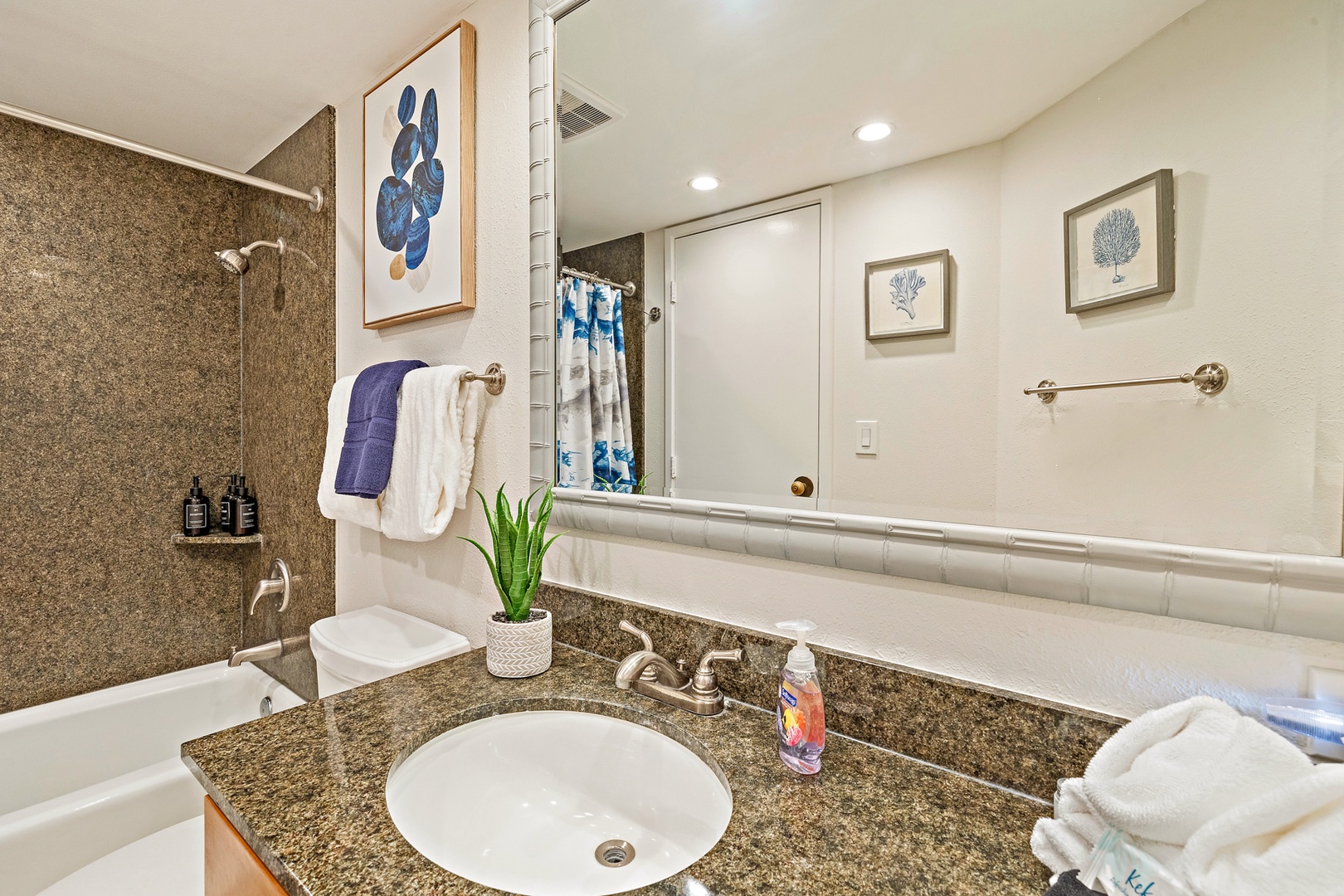 Lahaina Vacation Rentals, Kaanapali Shores 903 - The bathroom includes a stylish granite vanity, a modern sink, and bright lighting, offering a comfortable and elegant space to get ready for your day.