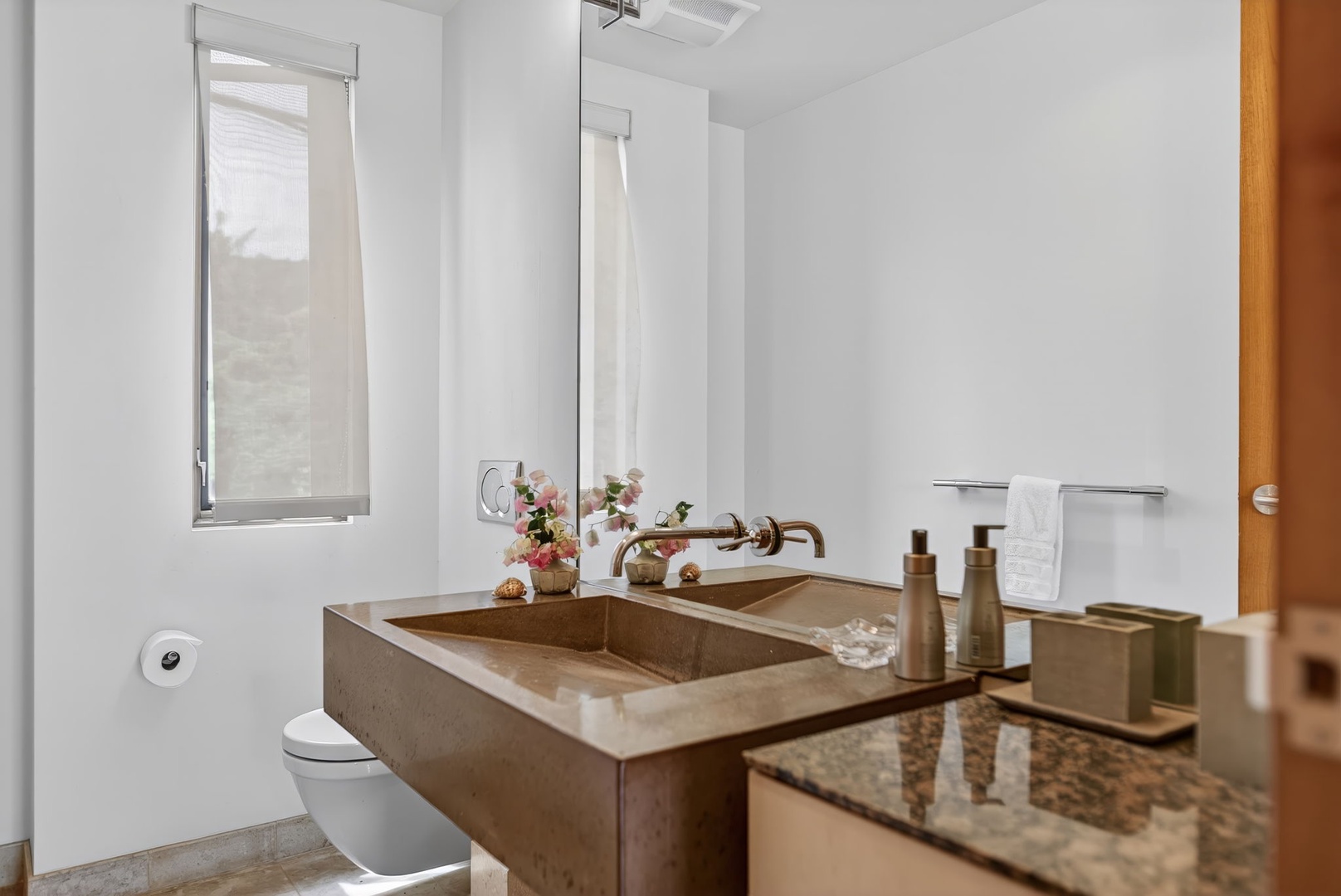 Haleiwa Vacation Rentals, HaleGator - A well-appointed bathroom features granite countertops, warm wood accents, and modern fixtures for everyday comfort.