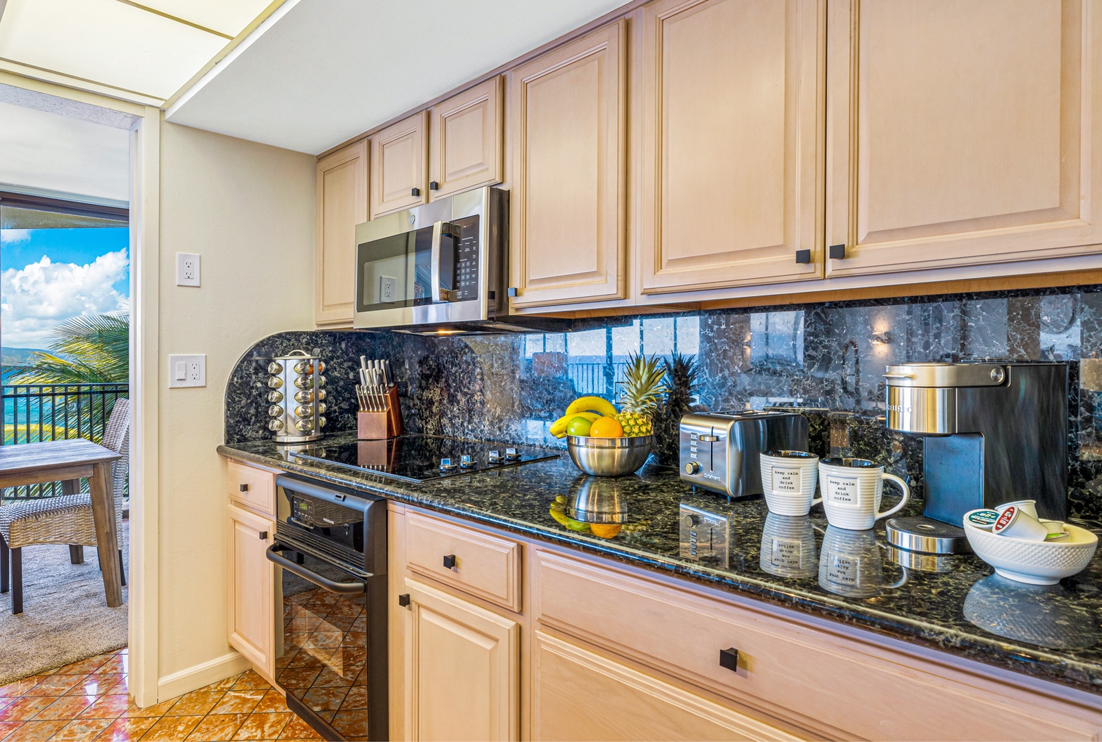 Lahaina Vacation Rentals, Kaanapali Shores 502 - This bright, galley-style kitchen is fully equipped and flows seamlessly into the dining area